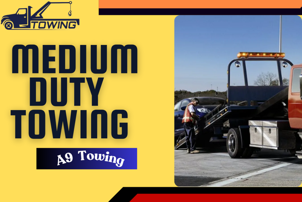 Medium-Duty Towing truck in San Leandro towing a commercial box truck from a busy roadside location